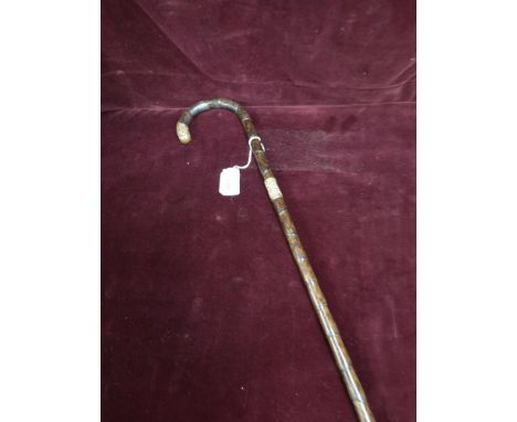 Antique walking stick with yellow metal mounts. 