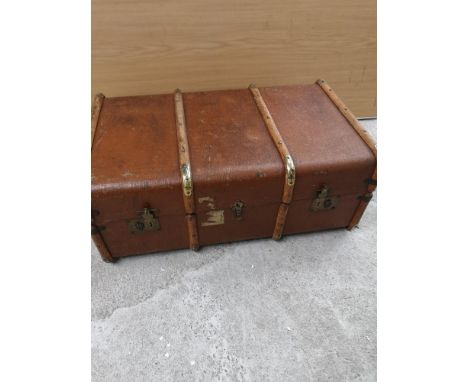 Vintage wooden bounded  trunk with opening mechanism. 