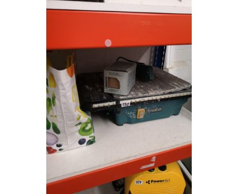 Erbauer electric tile cutter together with  4 boxes of tiles. 