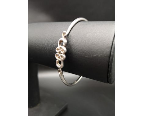 Silver hall marked edinburgh Celtic silver Bangle with infinity motif dated 2001. 12.8 grams . 