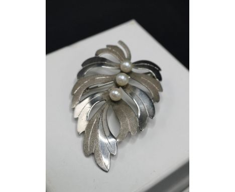 Silver Hall marked birmingham brooch set with seed pearl setting. Makers wbs. 