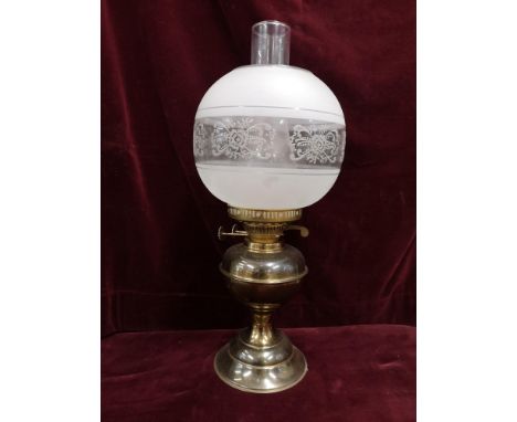 Vintage oil lamp with glass shade. 