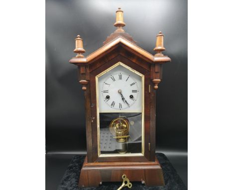 Vintage mantle clock with key and pendulum. 