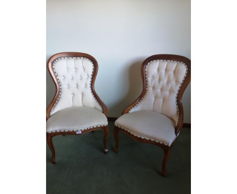 Pair of Reproduction button back chairs in really good condition. 