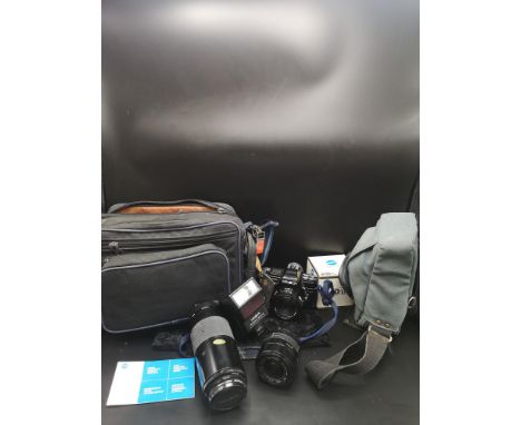 Lot of minolta camera lenses, minolta 7000 model camera  and accessories. 