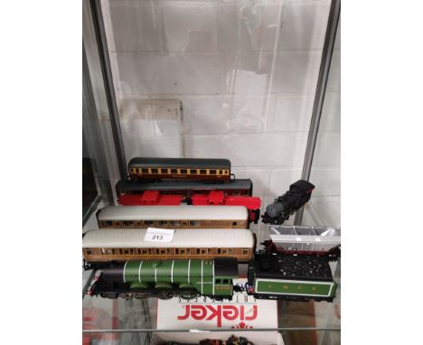 Shelf of train vehicles including flying scotmans loco and tender. 