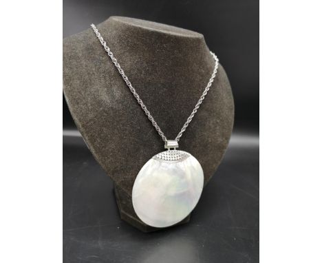 Large silver stunning mother of pearl pendant with silver mount  on a silver 925 belcher chain. 