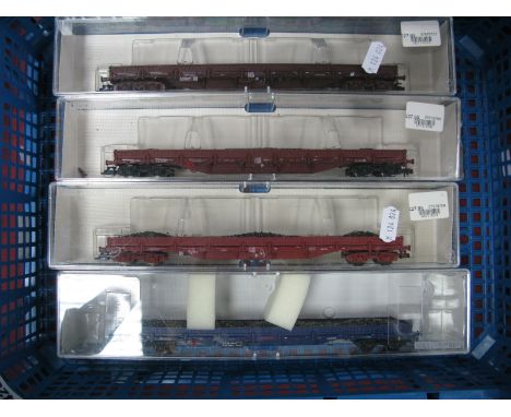 Four Cased Fleischmann 'HO' Gauge Long Wheelbase Low Sided Wagons, ref no's 8707, 8708, 8709 and 8711, very good condition, p