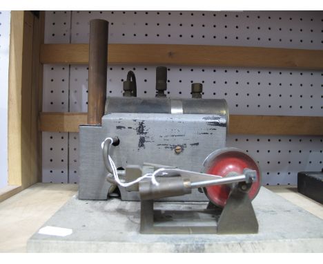 A Mid XX Century Stationery Steam Engine, horizontal boiler driving twin cylinders.