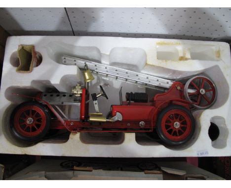 A Mamod FE1 Fire Engine, model has been steamed, funnel and burner present, a white residue noted to some metal parts, box po