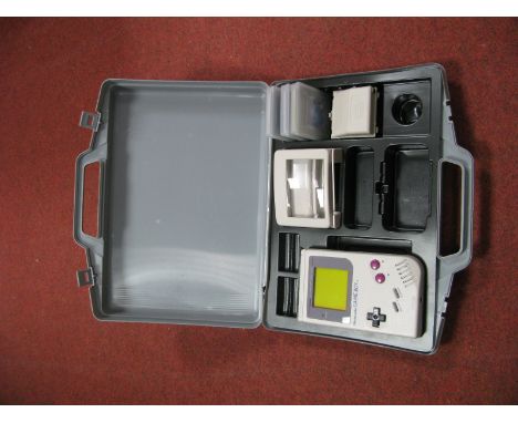 A Nintendo Gameboy Handheld Gaming Console, (circa 1989) S/N G34147598, Gamester power pack, magnifying clip, tetris, golf, P