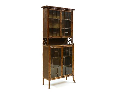 A bamboo cabinet,mid/late 19th century, with four glazed doors,69cm wide27cm deep167.5cm highProvenance: The Estate of Sir Ja