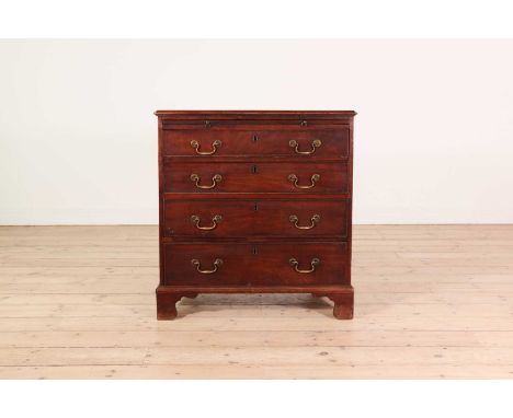 A George III mahogany bachelor's chest,the moulded rectangular top above a brushing slide and four cockbeaded drawers, raised