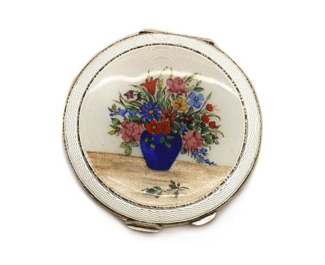 An enamelled silver compact,by Henry Clifford Davies, Birmingham 1939, of round form, the lid with white guilloche enamel wit
