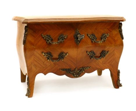 A miniature kingwood commode, 20th century, in the Louis XV style, with foliate cast gilt metal handles and hinged serpentine