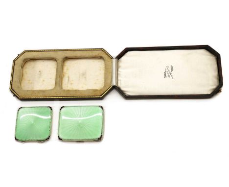 A cased silver compact and cigarette case,by Adie Brothers, Birmingham 1935, both decorated with green guilloche enamel in a 