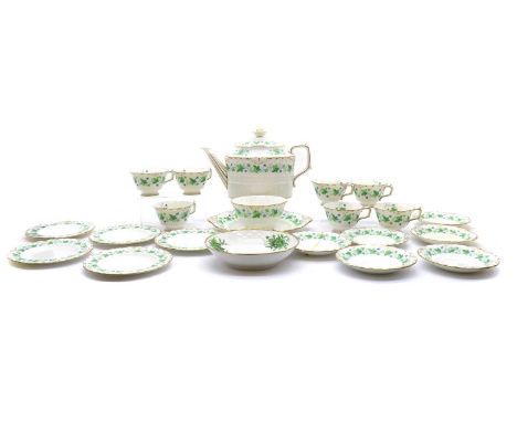 A Royal Crown Derby porcelain part-tea service,mid 20th century, with a printed border of trailing leaves, teapot and cover, 