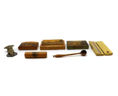 A collection of Mauchline ware,to include a paperweight titled 'Montpelier Spa', 10cm long, a snuff box, 8cm long, a needle c