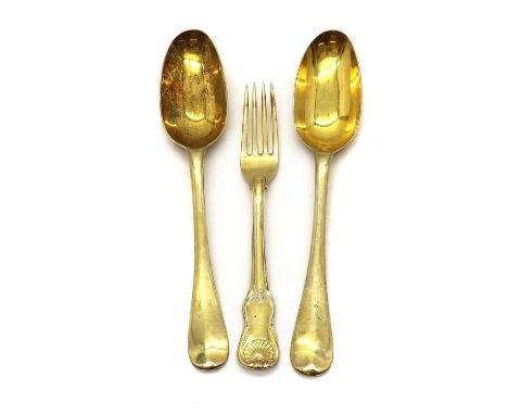 A pair of silver gilt dessert spoons,18th century, hallmarks indistinct, Hanovarian pattern,together with a fork,hallmarks in