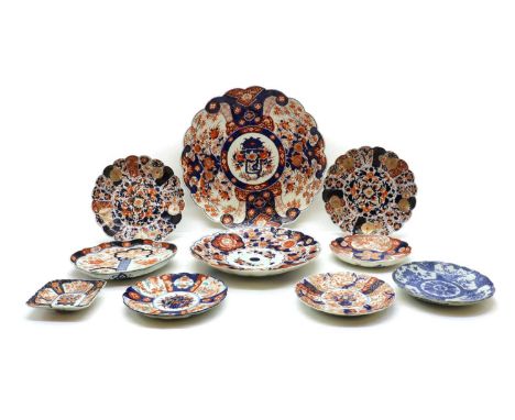 A collection of Japanese Imari plates,19th-20th century, comprising: eight lobed plates, all decorated with flowers in shaped