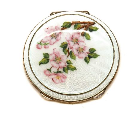An enamelled silver compact,by Barker Ellis Silver Co., Birmingham 1966, of circular form, the cover enamelled in white over 