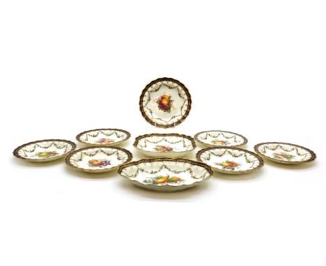 A Royal Worcester porcelain dessert setdecorated by E. Phillips, five with date code for 1924, painted with flowers and fruit
