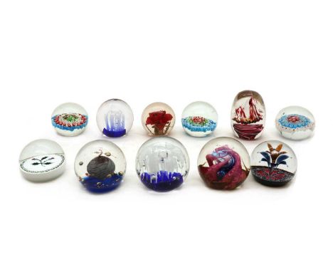 A collection of glass paperweights20th century, to include examples by Selkirkglass, Caithness, Hippocampus and three unsigne