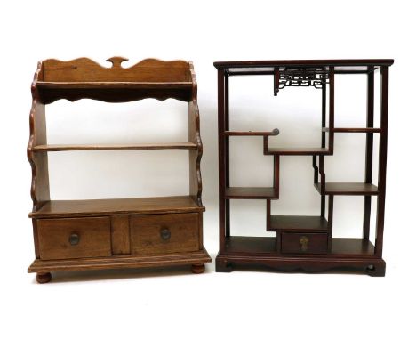 A Chinese hardwood display cabinet,19th century, with a configuration of open shelves, above a pull-out drawer,40cm wide15cm 