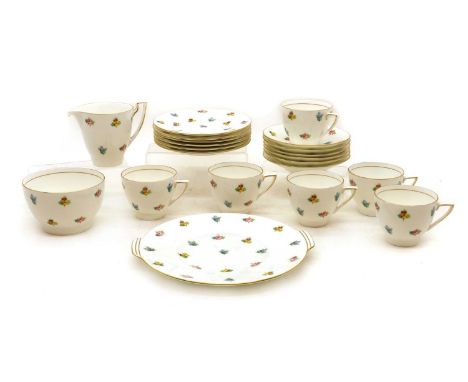 A Minton porcelain tea service,early 20th century, decorated with roses, pansies and forget-me-nots, comprising a cake plate,