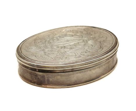 A George I silver snuff box, circa 1720, of oval form, the lid with moulded edges engraved with mirrored cypher 'TC' set with