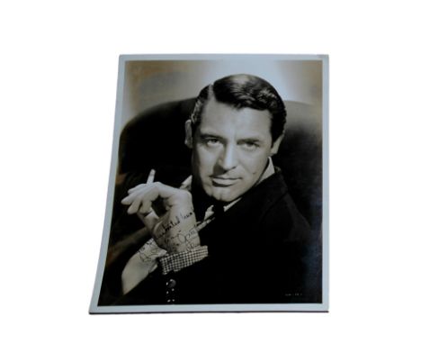 Cary Grant - Autographed 10x8 portrait Inscribed "To Illustrated Weekly of Indiana Season's Greetings" and signed Cary Grant 