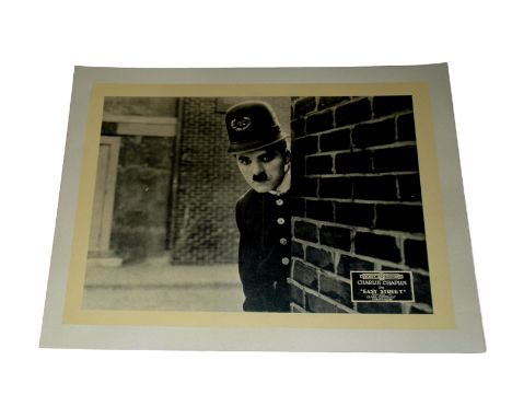 1917 - Easy Street - Lobby Card - Portrait Card of Charlie Chaplin the police constable.   Condition: Good to fine
