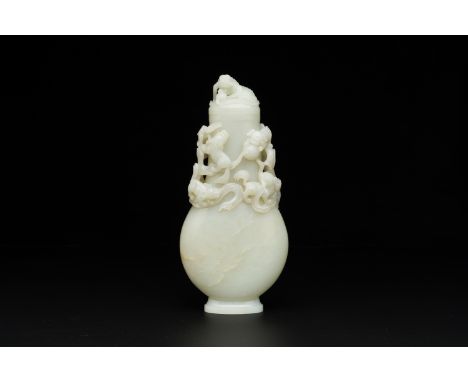 Full title: A fine Chinese white jade 'buddhist lions' vase and cover, QingDescription:H.: 25,5 cm Provenance:- The private c