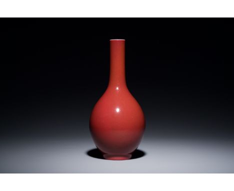 Full title: A Chinese monochrome dark ruby-red-glazed bottle vase, Qianlong mark and of the periodDescription:H.: 21 cm Prove
