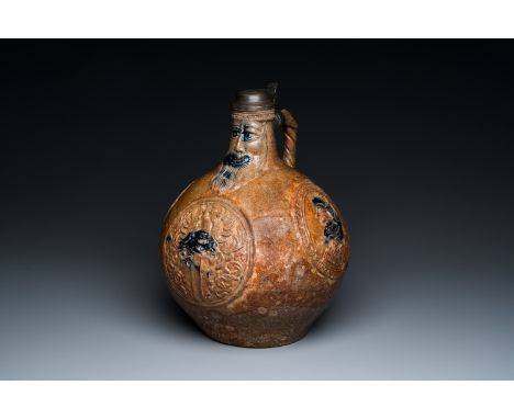 Full title: A large pewter-lidded armorial stoneware bellarmine jug with portrait medallions, Frechen, Germany, dated 1603 an