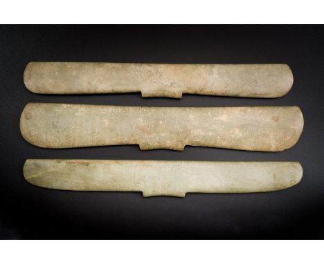 Full title: Three Chinese archaic calcified jade pendants, probably Liangzhu cultureDescription:L.: 32 cm - H.: 5,3 cm (the l