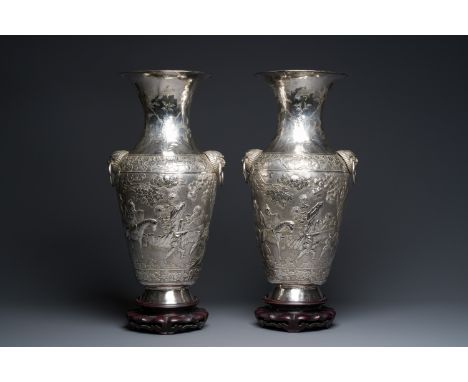 Full title: A pair of Chinese silver vases depicting 'Guo Ziyi's birthday', Qingyun 慶雲 mark, 19th C.Description:H.: 54 cmH.: 