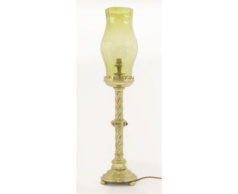 A Gothic Revival brass table lamp, with cabochons and a green glass shade, converted to electricity, 72cm high