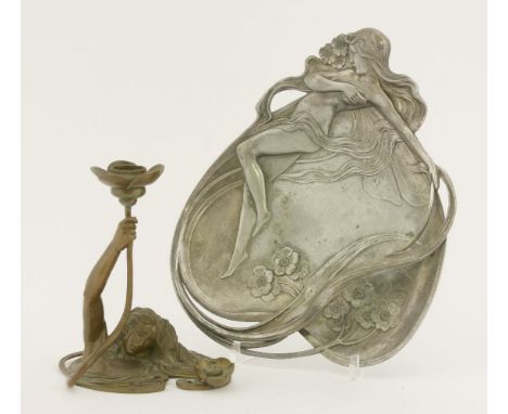 A patinated bronze candlestick,modelled as a water nymph rising from the base, holding a lily flower,16.5cm high, anda WMF pe