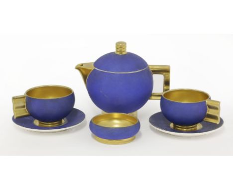 A French tea set for two,by Robj, each piece of globular form with gilt details, comprising:a teapot,two cups and saucers, an