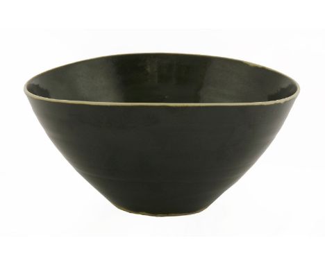 *A small stoneware bowl, by Dame Lucie Rie (1903-1995) with a black interior and exterior glaze, impressed seal marks, also i