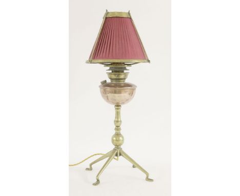 A brass and copper oil lamp, designed by W A S Benson, converted to electricity, 62cm high