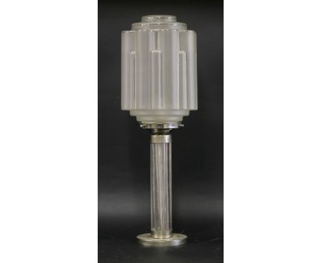 A table lamp,with a clear and frosted shade with chrome mounts and a glass reeded column,stamped 'KAZA, Made in France',58cm 