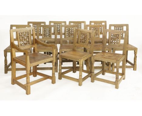 Twelve Robert 'Mouseman' Thompson dining chairs,each with latticed backs, leather seats, worn, comprising eleven singles and 