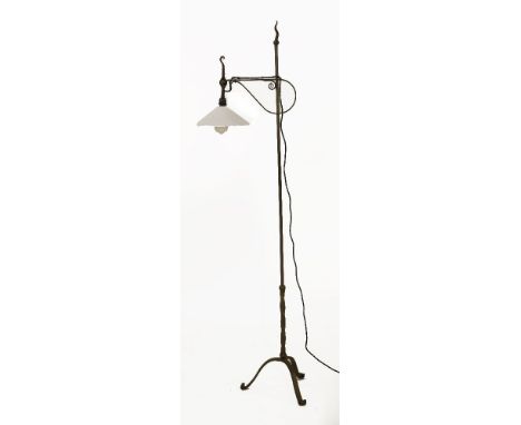An Arts & Crafts iron standard lamp, with a conical white glass shade, 154cm high