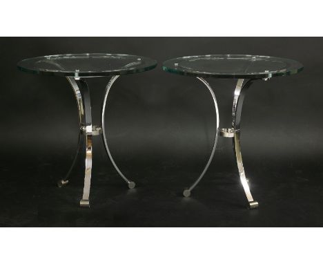 A pair of chrome side tables,with circular glass tops and tripod stands,69cm diameter69cm high (2)