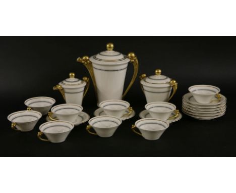A Limoges teaset,with a black and grey band and gilt details, comprising:nine cups and saucers,a milk jug,a sucrier,a teapot,