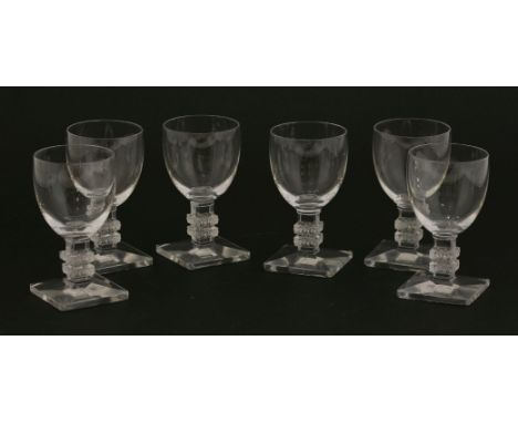 A set of six Lalique 'Argos' wine glasses,each with a stepped square column and foot, etched 'Lalique France',8.2cm high (6)