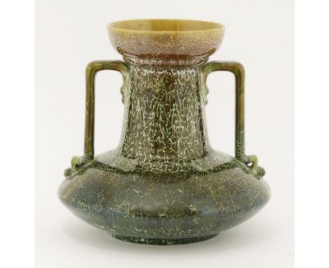 A Linthorpe pottery vase,designed by Dr Christopher Dresser, with twin handles and a trailing mustard, green and 'crackled' g