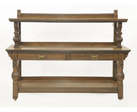 A burr oak buffet,with three tiers and two frieze drawers, stamped 'Lamb, Manchester, 35102',152cm wide46cm deep113cm high
